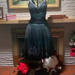 Beautiful holiday, halter neck, dress in dark green.